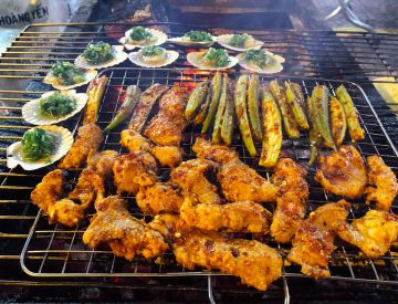 Saigon By Night and Street Food tour by scooter and motorbike